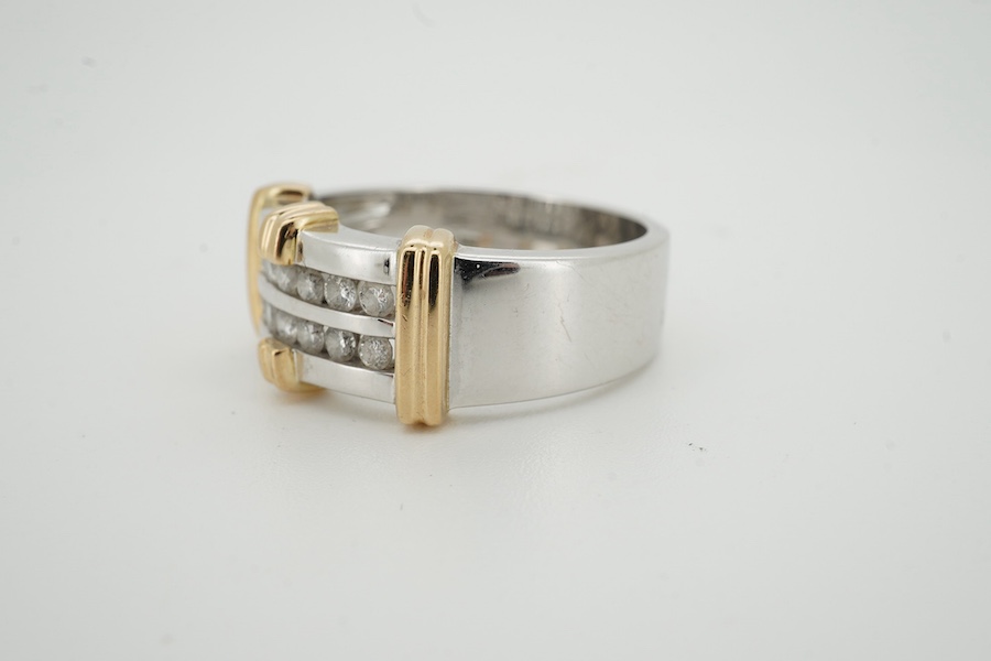 A modern two colour 10kt and two row channel set diamond dress ring, size U/V, gross weight 11.2 grams. Condition - fair to good